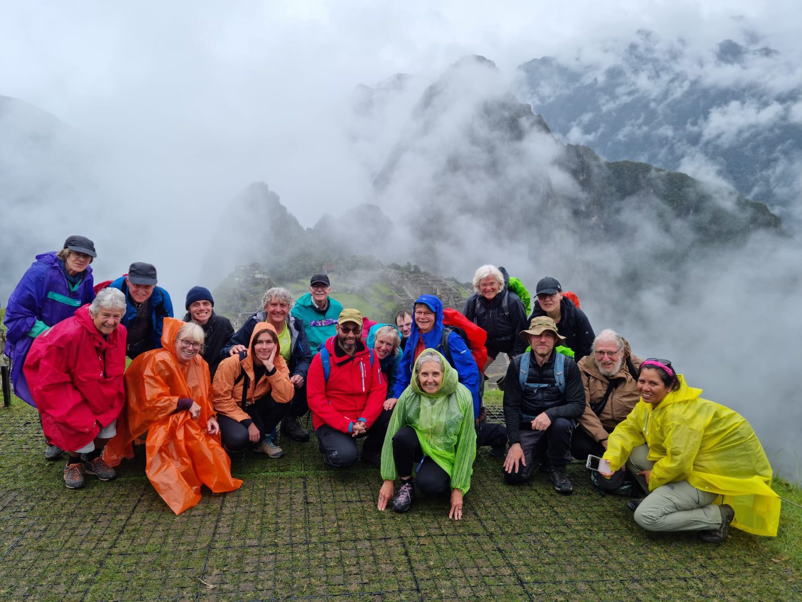 A group at Machu Picchu under cloud